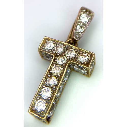 607 - 9K Yellow Gold Stone Set Initial 'T' Charm/Pendant.
Measures 2cm.
Weight: 4.9g
SC-3071