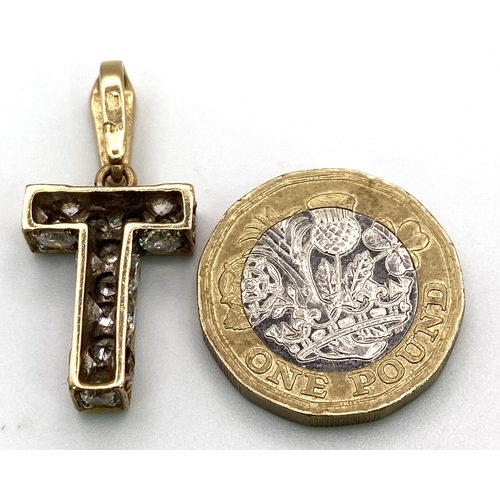 607 - 9K Yellow Gold Stone Set Initial 'T' Charm/Pendant.
Measures 2cm.
Weight: 4.9g
SC-3071