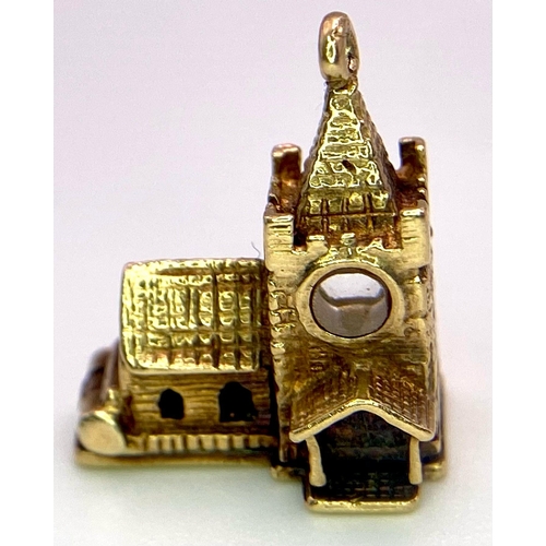 746 - A 9K Yellow Gold Church Charm/Pendant. 16mm. 3g weight.