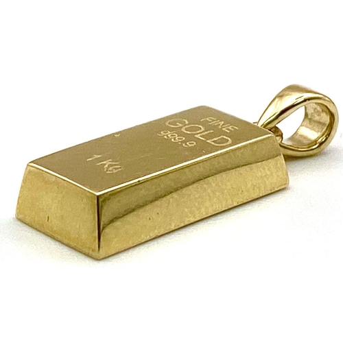 770 - A 9K Yellow Gold Ingot Bar Pendant. 2mm length, 1.6g total weight.