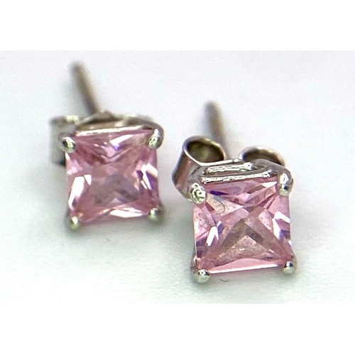 784 - A Pair of 9K White Gold, Princess Cut Pink Cubic Zirconia Stud Earrings. 0.7g total weight.