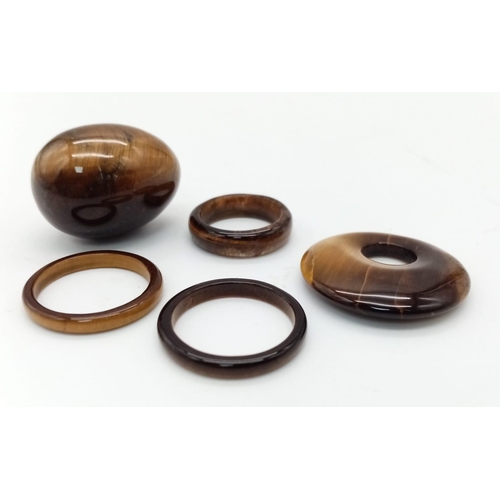 857 - A Lot of Five Tigers Eye Pieces. Three rings, pendant and a small egg!