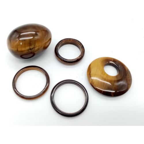 857 - A Lot of Five Tigers Eye Pieces. Three rings, pendant and a small egg!