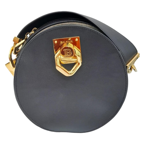 535 - A Balmain Black 'Twist' Crossbody Bag. Leather exterior, with gold-tone hardware and zipper and sing... 