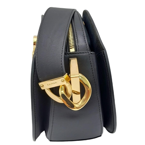 535 - A Balmain Black 'Twist' Crossbody Bag. Leather exterior, with gold-tone hardware and zipper and sing... 