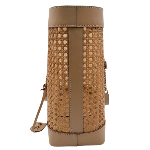 732 - A Saint Laurent Beige Tote Bag. Woven rattan and leather trim exterior. Magnetic closure, gold-toned... 