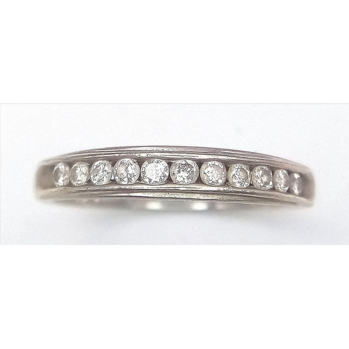 408 - A 9K White Gold Diamond Half Eternity Ring. Size N. 1.7g total weight. Ref: 14491