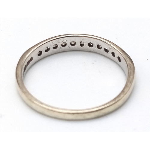 408 - A 9K White Gold Diamond Half Eternity Ring. Size N. 1.7g total weight. Ref: 14491