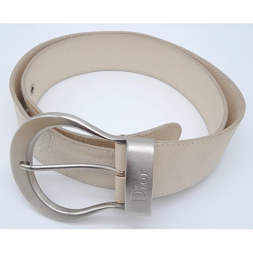 704 - Stylish Christian Dior Leather Belt. Made in Italy, this pearlescent ivory white CD belt measures 93... 