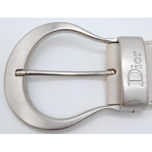 704 - Stylish Christian Dior Leather Belt. Made in Italy, this pearlescent ivory white CD belt measures 93... 