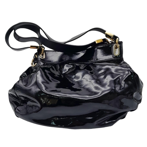 697 - Jimmy Choo Black Patent Leather Handbag.
Gorgeous feel to this handbag. Double strapped, with engrav... 