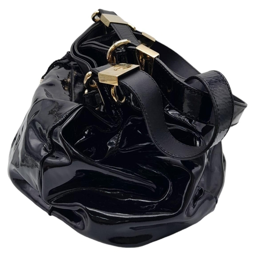 697 - Jimmy Choo Black Patent Leather Handbag.
Gorgeous feel to this handbag. Double strapped, with engrav... 