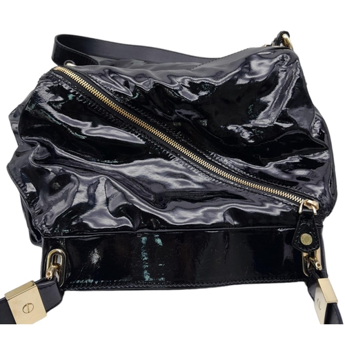 697 - Jimmy Choo Black Patent Leather Handbag.
Gorgeous feel to this handbag. Double strapped, with engrav... 