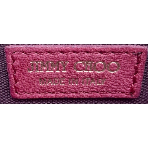 711 - A Jimmy Choo Magenta Bag. Leather exterior with gold-tone hardware and chain strap. Canvas interior,... 