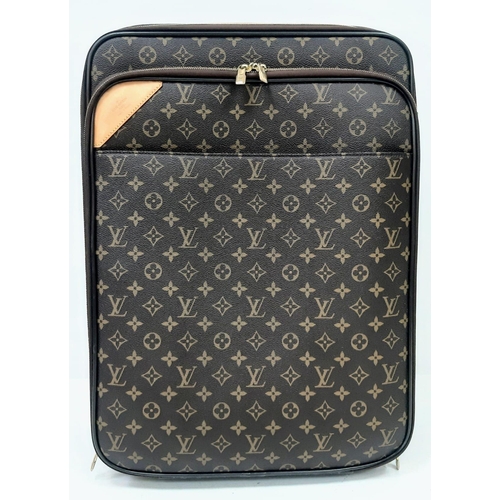 725 - A Louis Vuitton Monogram Pegase Suitcase. Durable leather exterior. Front compartment with zipper, c... 