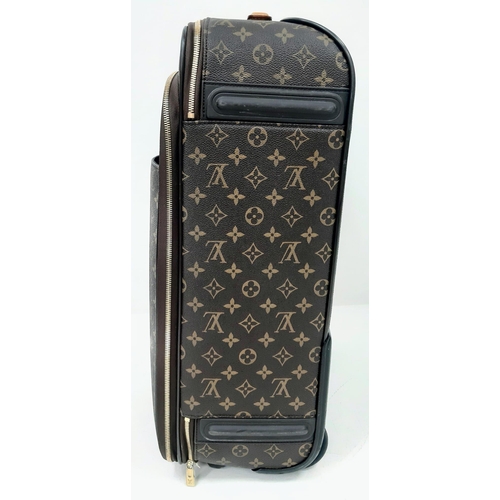 725 - A Louis Vuitton Monogram Pegase Suitcase. Durable leather exterior. Front compartment with zipper, c... 