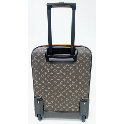 725 - A Louis Vuitton Monogram Pegase Suitcase. Durable leather exterior. Front compartment with zipper, c... 