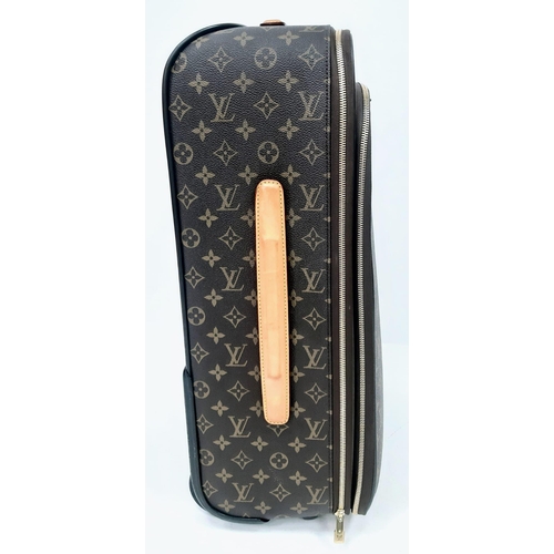 725 - A Louis Vuitton Monogram Pegase Suitcase. Durable leather exterior. Front compartment with zipper, c... 