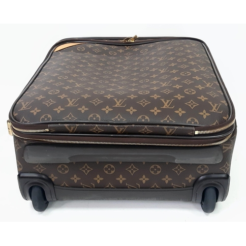 725 - A Louis Vuitton Monogram Pegase Suitcase. Durable leather exterior. Front compartment with zipper, c... 