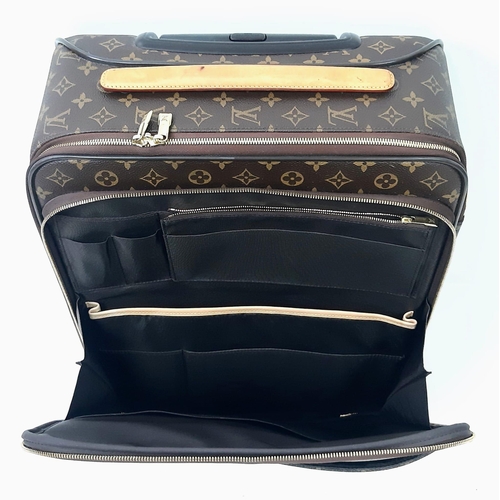 725 - A Louis Vuitton Monogram Pegase Suitcase. Durable leather exterior. Front compartment with zipper, c... 