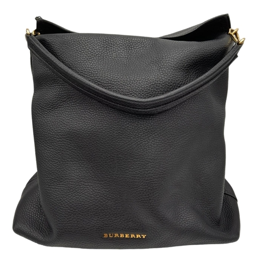 144 - A Burberry Black Cale Hobo Bag. A leather exterior with a looping shoulder strap, gold tone hardware... 