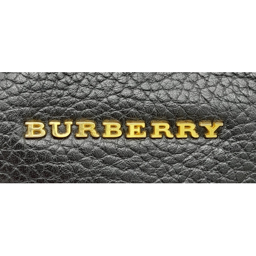 144 - A Burberry Black Cale Hobo Bag. A leather exterior with a looping shoulder strap, gold tone hardware... 