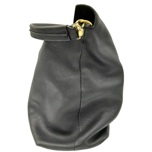 144 - A Burberry Black Cale Hobo Bag. A leather exterior with a looping shoulder strap, gold tone hardware... 