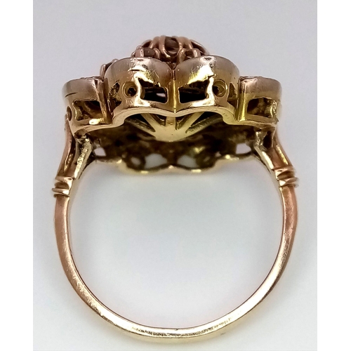 151 - A 14K YELLOW GOLD VINTAGE DIAMOND RING, OLD CUT DIAMONDS IN THE FLORAL DESIGN SETTING.  SIZE M/N. TO... 