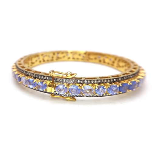 46 - A Sensational Gilded 925 Silver Tanzanite and Diamond Gemstone Tennis Bracelet. Clip open design. 55... 