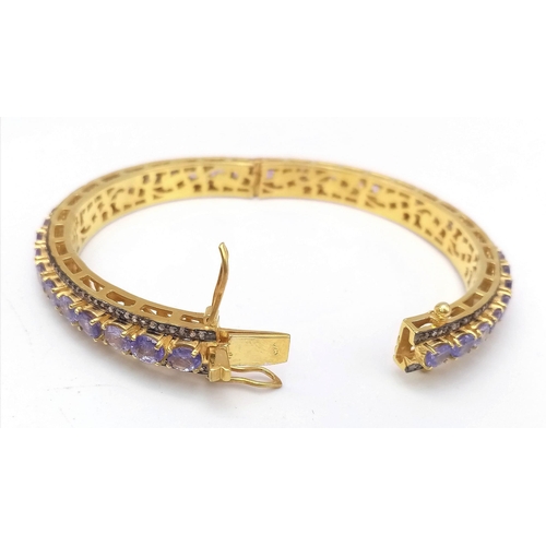 46 - A Sensational Gilded 925 Silver Tanzanite and Diamond Gemstone Tennis Bracelet. Clip open design. 55... 