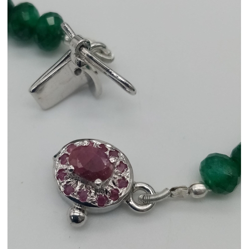 171 - A 230ctw Emerald Gemstone Necklace with Ruby and 925 Silver Clasp. Graduating faceted emerald beads.... 