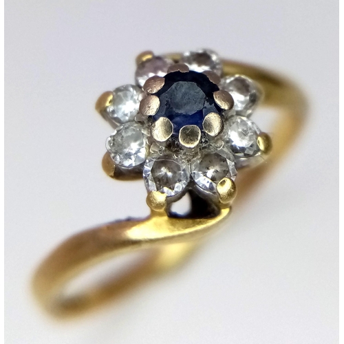 218 - A 18K YELLOW GOLD VINTAGE DIAMOND & SAPPHIRE LUSTER TWIST RING IN THE FLORAL DESIGN 3.2G SIZE O