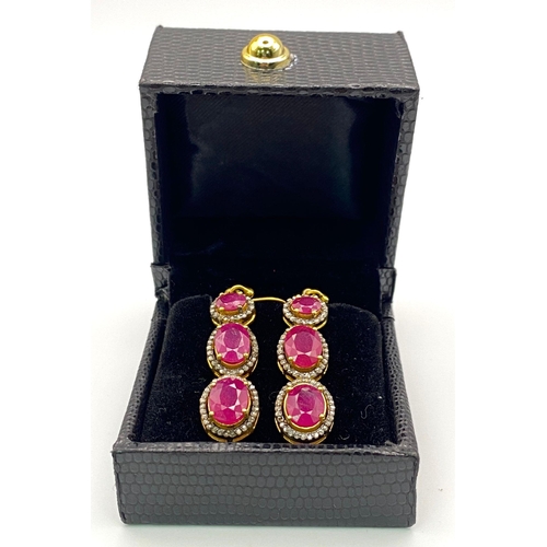 32 - A Pair of Ruby and Diamond Dangler Earrings set in Gilded 925 Silver. Ruby - 10ctw. 4cm drop. 8.62g ... 