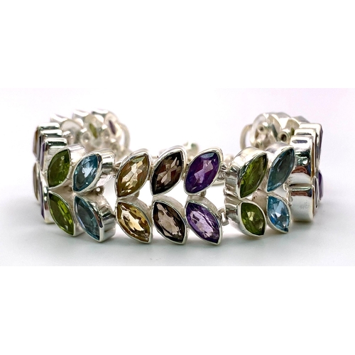 687 - A Marquise Shape Multi-Gemstone Floral Inspired Tennis Bracelet - with Amethyst, Citrine and Blue To... 