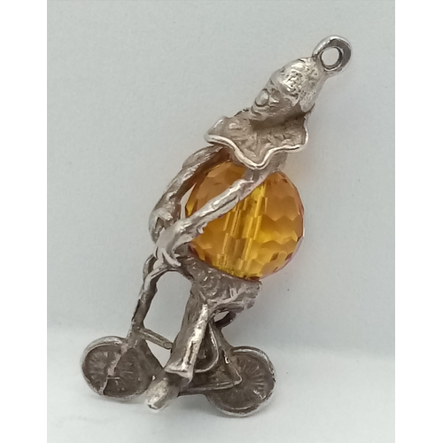 959 - Sterling Silver Clown/Jester on Bike, set with a Stone for his Belly, Charm/Pendant.
Measures 2.5cm ... 