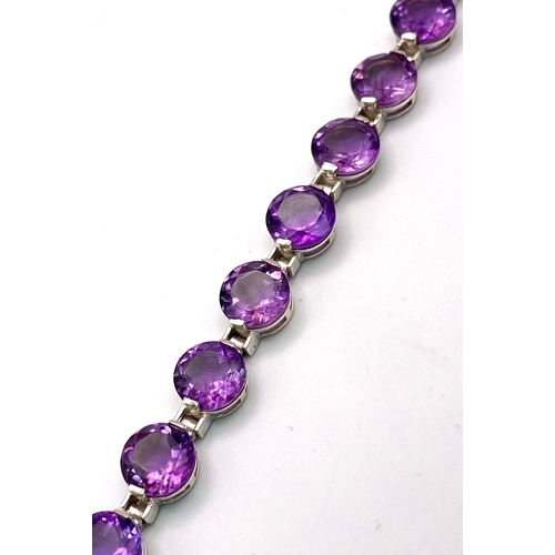 191 - A Faceted Round Cut Amethyst Gemstone Tennis Bracelet. 19cm. 21.52g total weight.