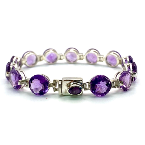 191 - A Faceted Round Cut Amethyst Gemstone Tennis Bracelet. 19cm. 21.52g total weight.