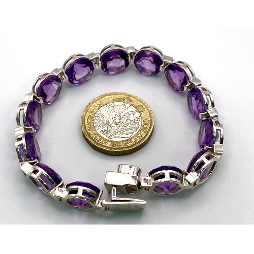 191 - A Faceted Round Cut Amethyst Gemstone Tennis Bracelet. 19cm. 21.52g total weight.