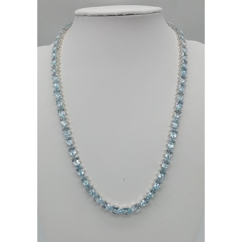 30 - A Scintillating Ice-Blue Topaz Tennis Necklace set in 925 Silver. 45cm length.