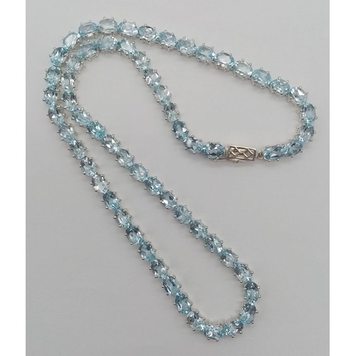 30 - A Scintillating Ice-Blue Topaz Tennis Necklace set in 925 Silver. 45cm length.