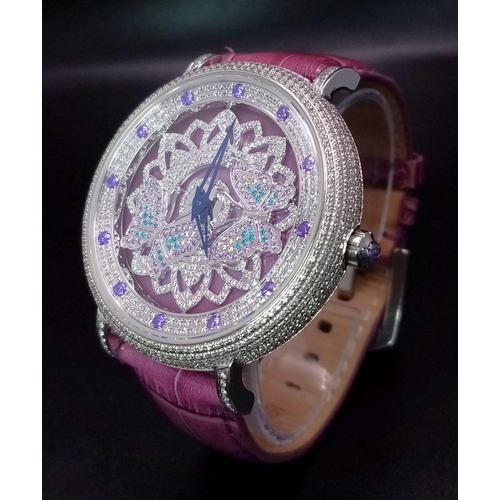 423 - An Hypnotic Oubus Diamond Encrusted Ladies Watch. Purple leather strap. Stainless steel diamond encr... 