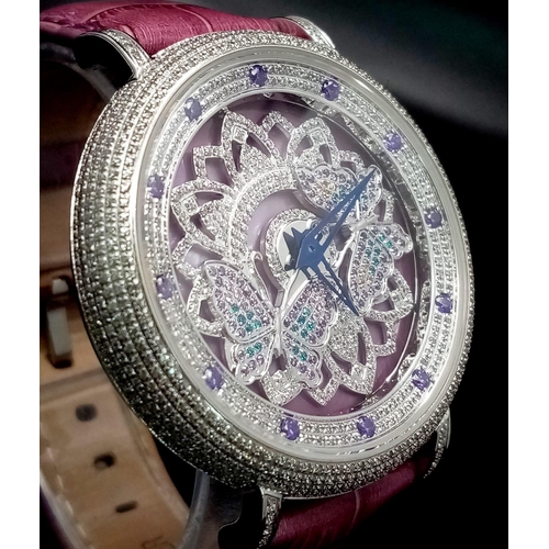 423 - An Hypnotic Oubus Diamond Encrusted Ladies Watch. Purple leather strap. Stainless steel diamond encr... 