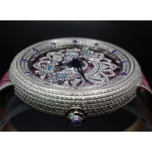 423 - An Hypnotic Oubus Diamond Encrusted Ladies Watch. Purple leather strap. Stainless steel diamond encr... 