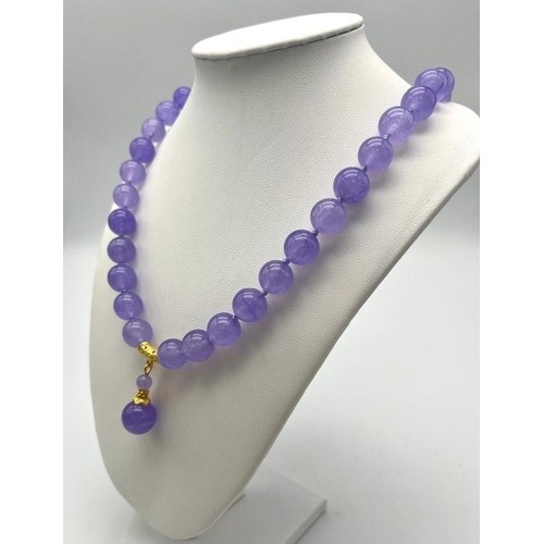 703 - A Lavender Jade Large Bead Necklace with Pendant Drop. 12mm jade beads with gilded accents and clasp... 