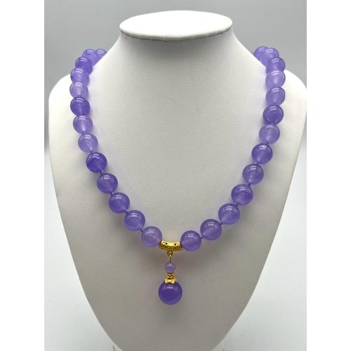 703 - A Lavender Jade Large Bead Necklace with Pendant Drop. 12mm jade beads with gilded accents and clasp... 