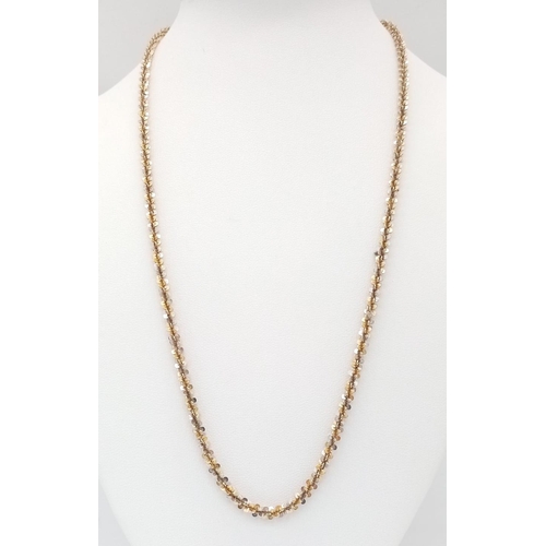 774 - A 9K WHITE AND YELLOW GOLD HEAVY TWIST NECK CHAIN , A REAL EYE CATCHER . 10.9gms   50cms