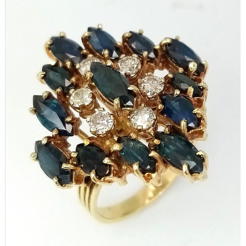 638 - An 18K Yellow Gold (tested) Diamond and Sapphire Dress Ring. Six brilliant round cut diamonds - 0.60... 