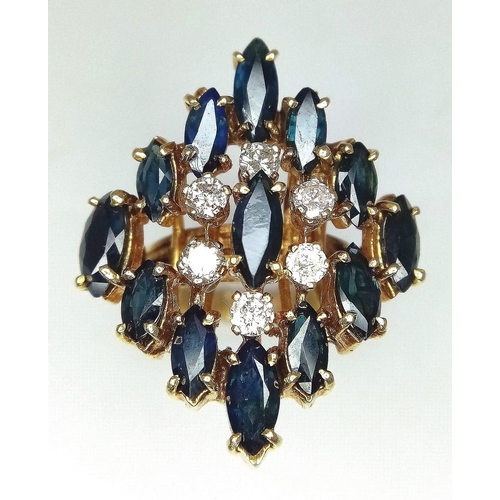 638 - An 18K Yellow Gold (tested) Diamond and Sapphire Dress Ring. Six brilliant round cut diamonds - 0.60... 