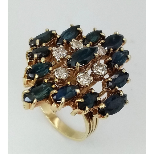 638 - An 18K Yellow Gold (tested) Diamond and Sapphire Dress Ring. Six brilliant round cut diamonds - 0.60... 