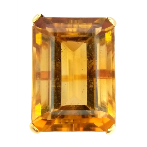 653 - An 18K Yellow Gold (tested) Citrine Ring. Immense 40ct approx, clean, rectangular cut citrine stone.... 